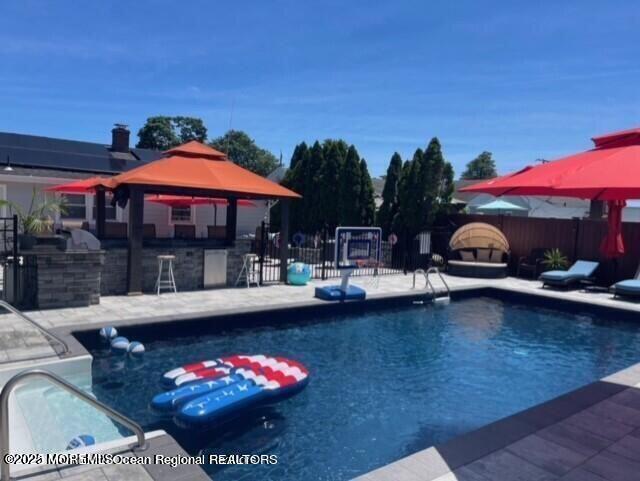 47 Poplar Avenue West Long Branch, NJ 07764 - Photo 11 of 21 a view of a swimming pool with a patio