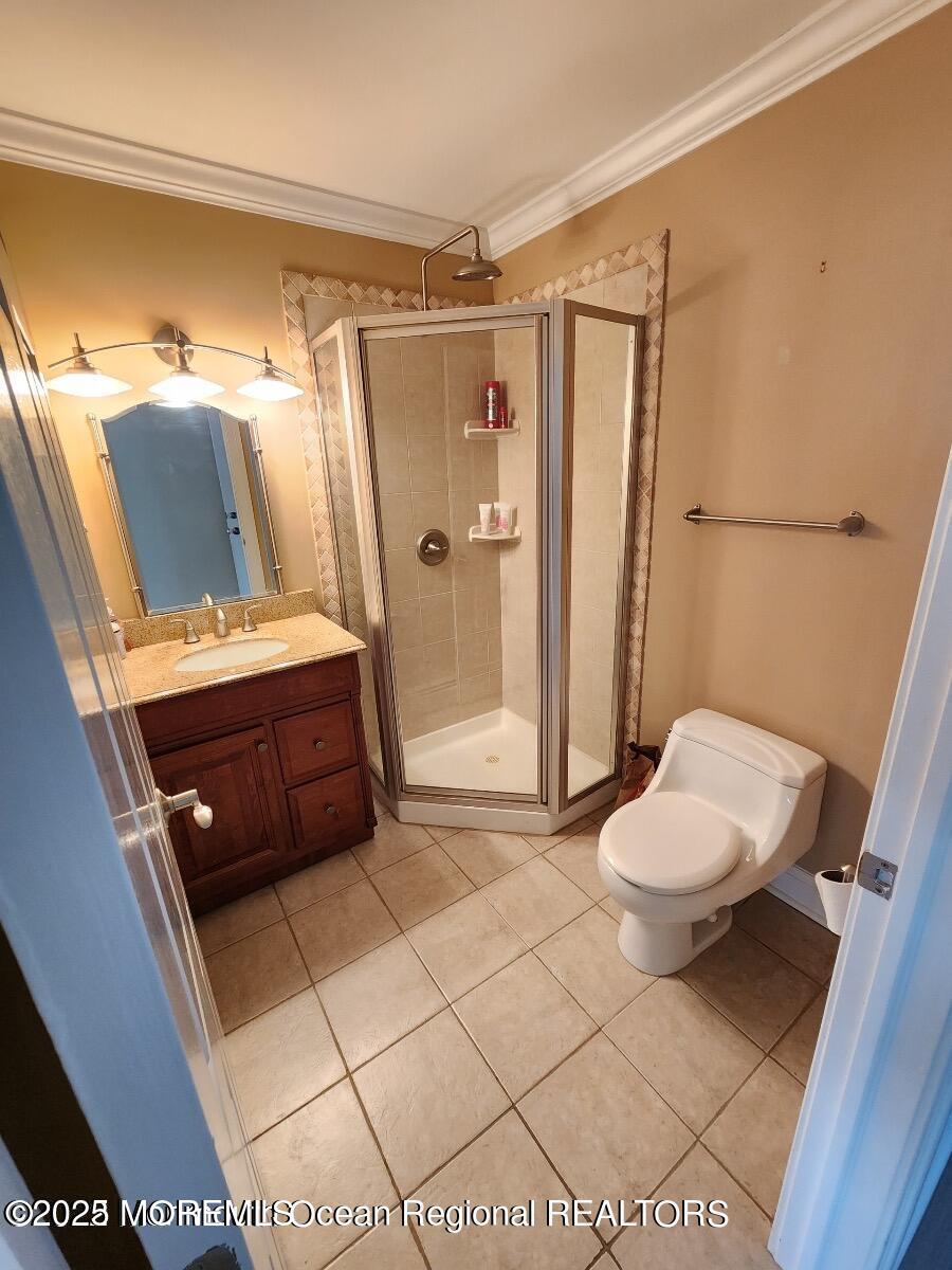 47 Poplar Avenue West Long Branch, NJ 07764 - Photo 20 of 21 a bathroom with a toilet a sink and shower
