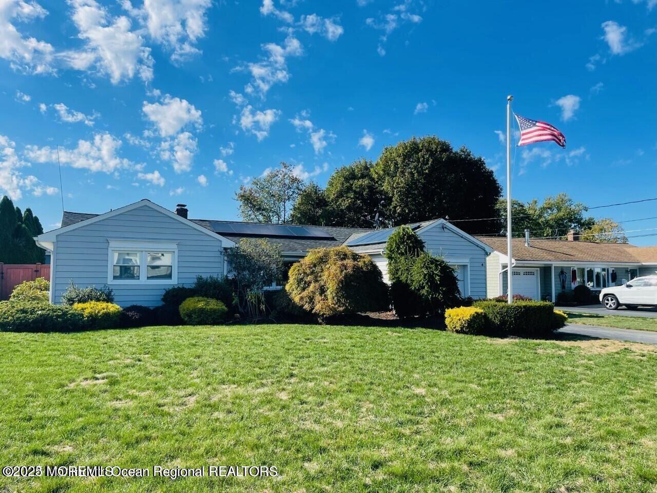47 Poplar Avenue West Long Branch, NJ 07764 - Photo 2 of 21 a front view of a house with garden