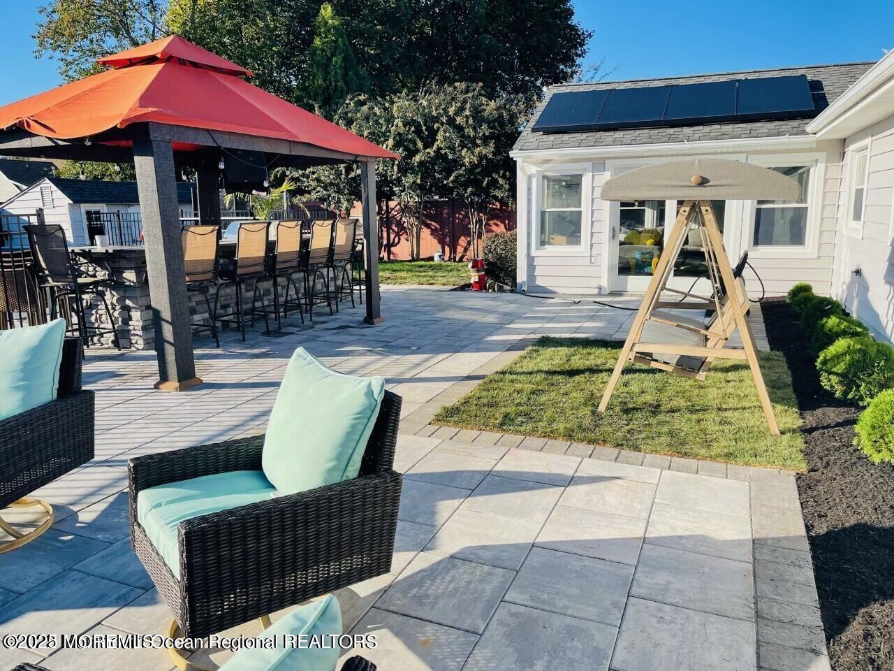 47 Poplar Avenue West Long Branch, NJ 07764 - Photo 5 of 21 a view of a house with backyard porch and sitting area
