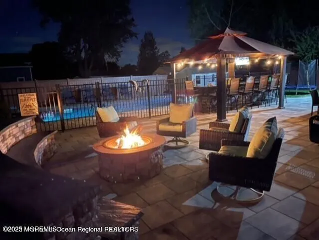 a view of a swimming pool with seating space