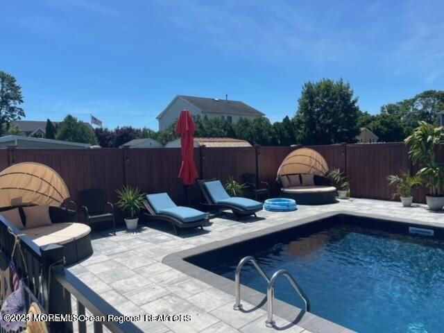 47 Poplar Avenue West Long Branch, NJ 07764 - Photo 9 of 21 a backyard of a house with table and chairs