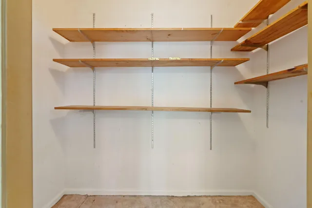 a view of a lake with houses in the back