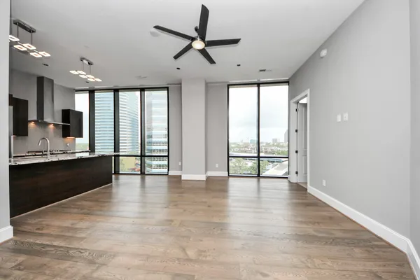 a view of a kitchen with a sink and a ceiling fan