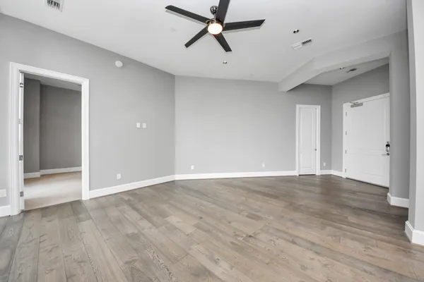 a large white kitchen with a large window