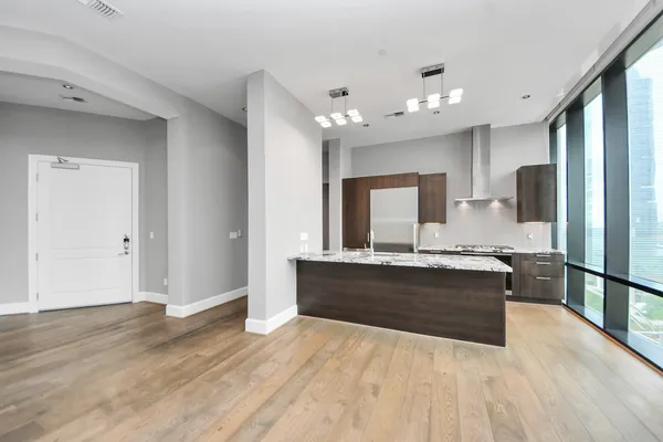 a large kitchen with a stove and refrigerator