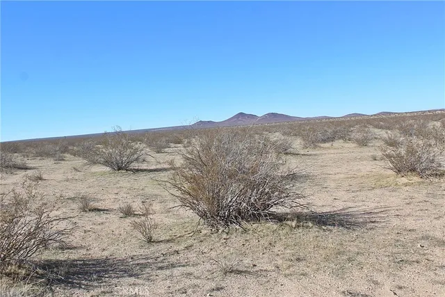a view of mountains and valleys
