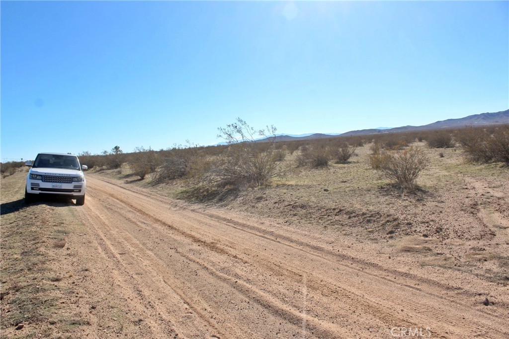 112 Highway 395 Hines, OR 97738 - Photo 8 of 8 a view of a dry yard with mountain