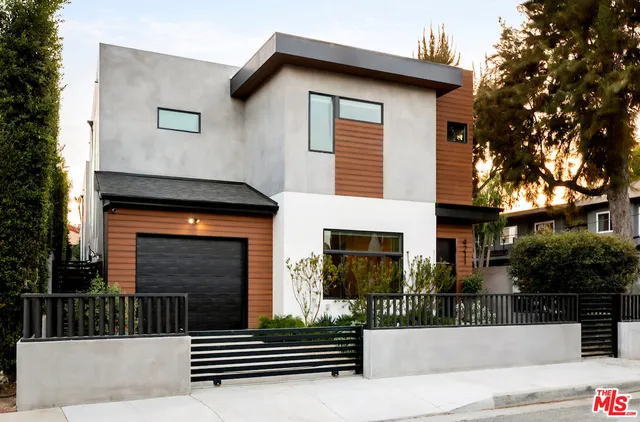 a front view of a house with stairs