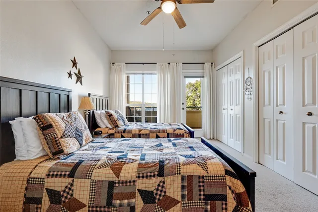 a bed room with bed and window