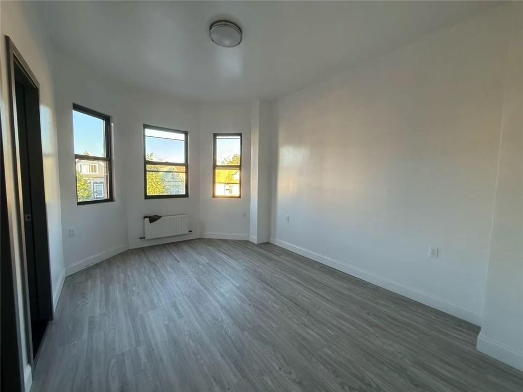 320 Bay Ridge Parkway Brooklyn, NY 11209 - Photo 4 of 10 an empty room with windows