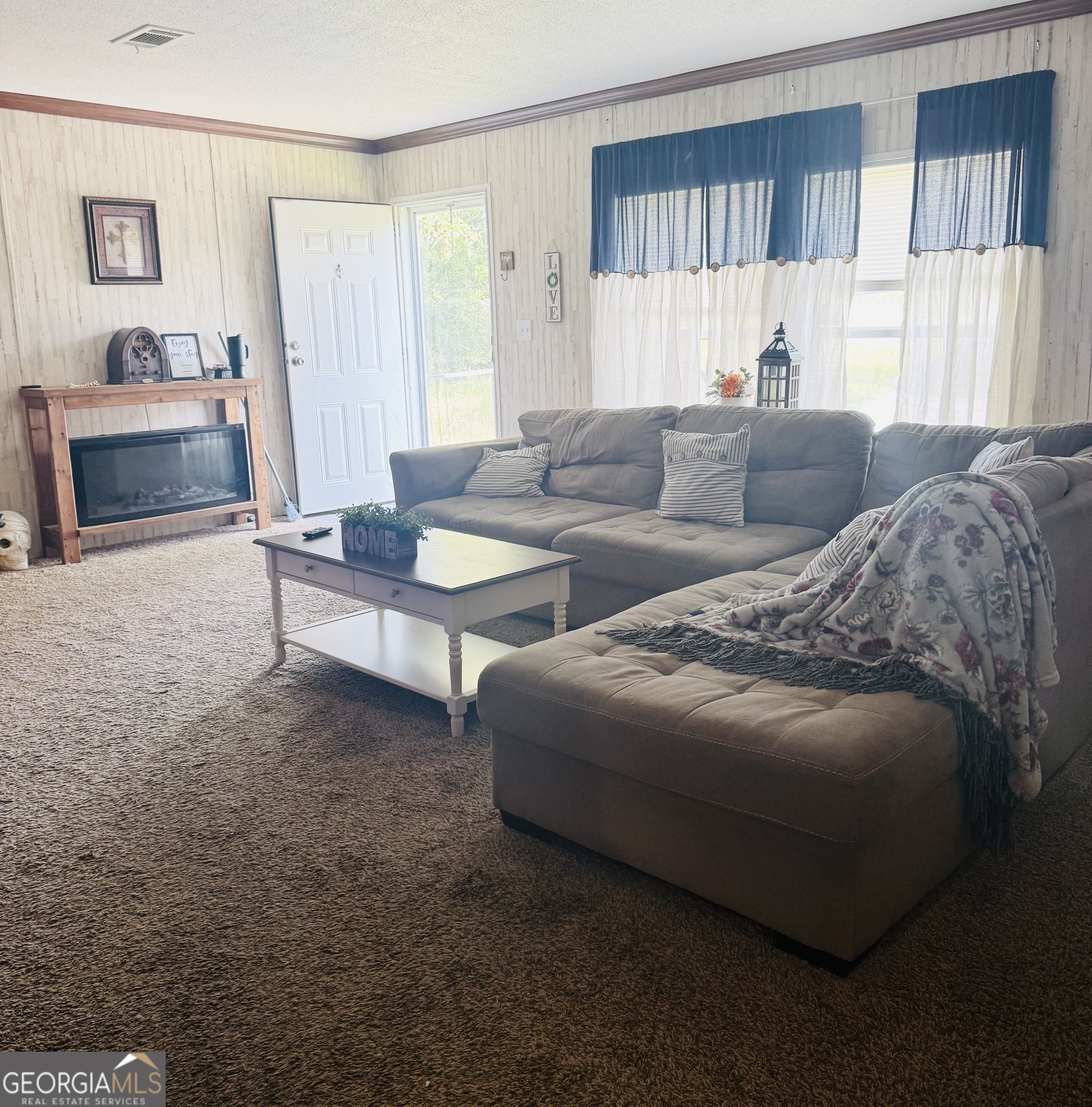 92 Graham Lane Claxton, GA 30417 - Photo 16 of 20 a living room with a couch and a window