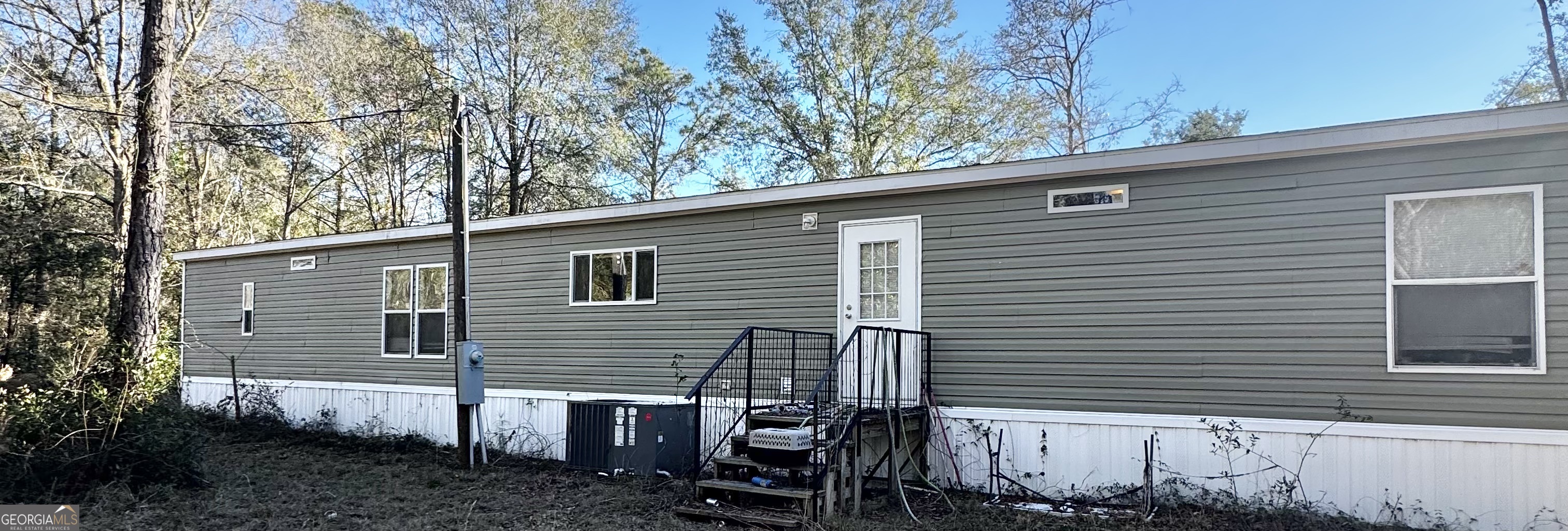 92 Graham Lane Claxton, GA 30417 - Photo 3 of 20 a view of a house with a yard