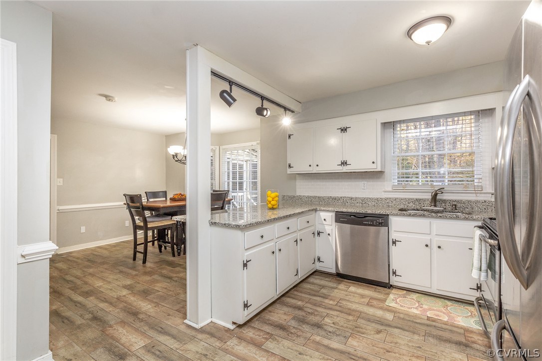 3905 Timber Ridge Place Midlothian, VA 23112 - Photo 14 of 40 Open Kitchen with Granite Counter Tops & Stainless