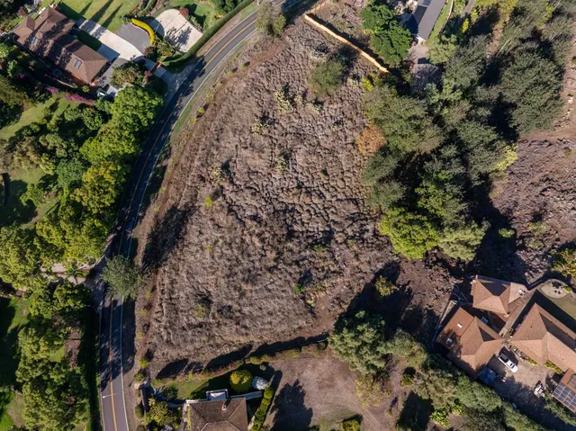 a aerial view of a house with a yard