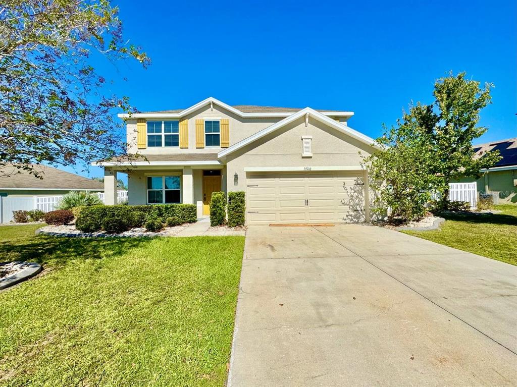 35743 Hillbrook Avenue Zephyrhills, FL 33541 - Photo 2 of 44 a view of a yard in front of house