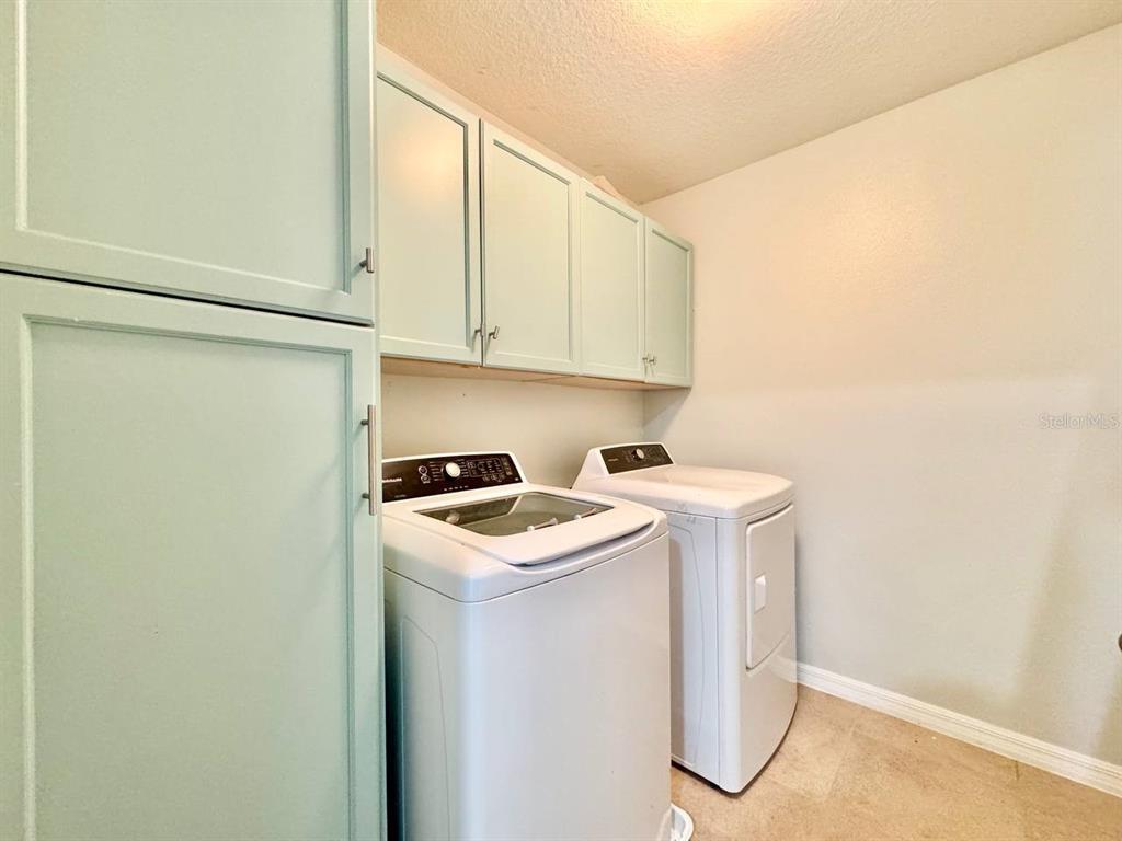 35743 Hillbrook Avenue Zephyrhills, FL 33541 - Photo 27 of 44 a utility room with dryer and washer