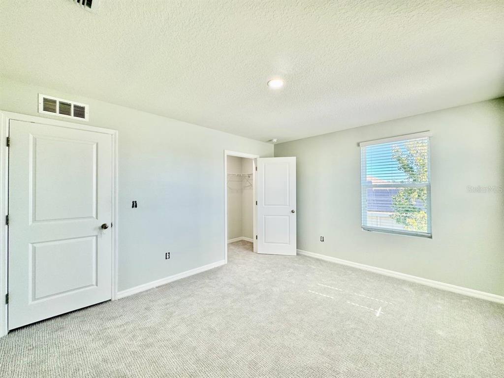 35743 Hillbrook Avenue Zephyrhills, FL 33541 - Photo 30 of 44 an empty room with windows