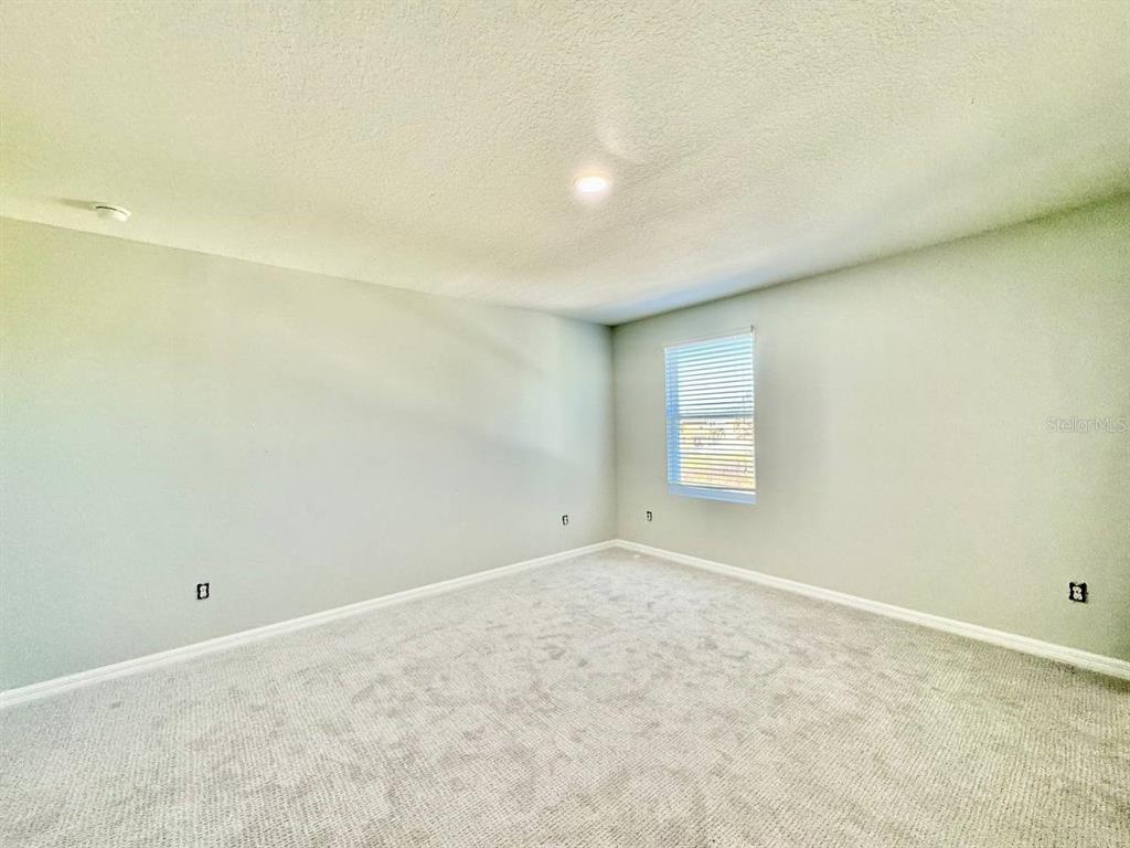 35743 Hillbrook Avenue Zephyrhills, FL 33541 - Photo 35 of 44 a view of an empty room and window