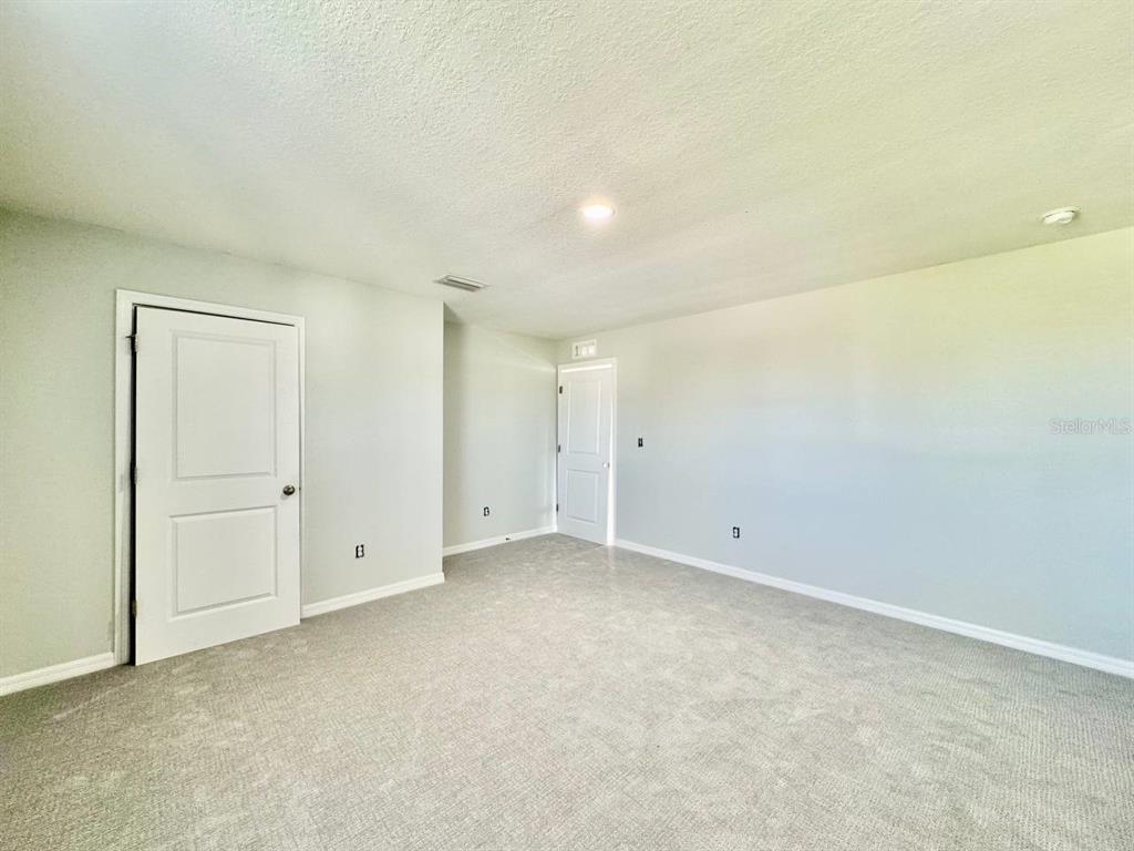 35743 Hillbrook Avenue Zephyrhills, FL 33541 - Photo 37 of 44 an empty room with an entryway
