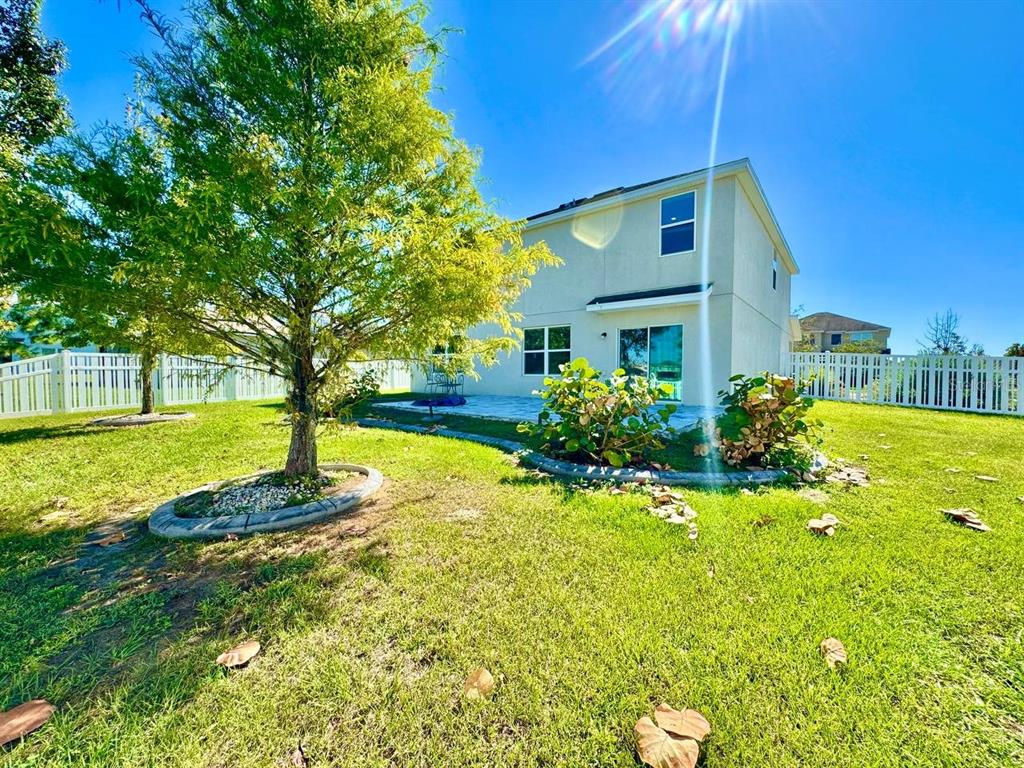 35743 Hillbrook Avenue Zephyrhills, FL 33541 - Photo 40 of 44 a front view of a house with a yard