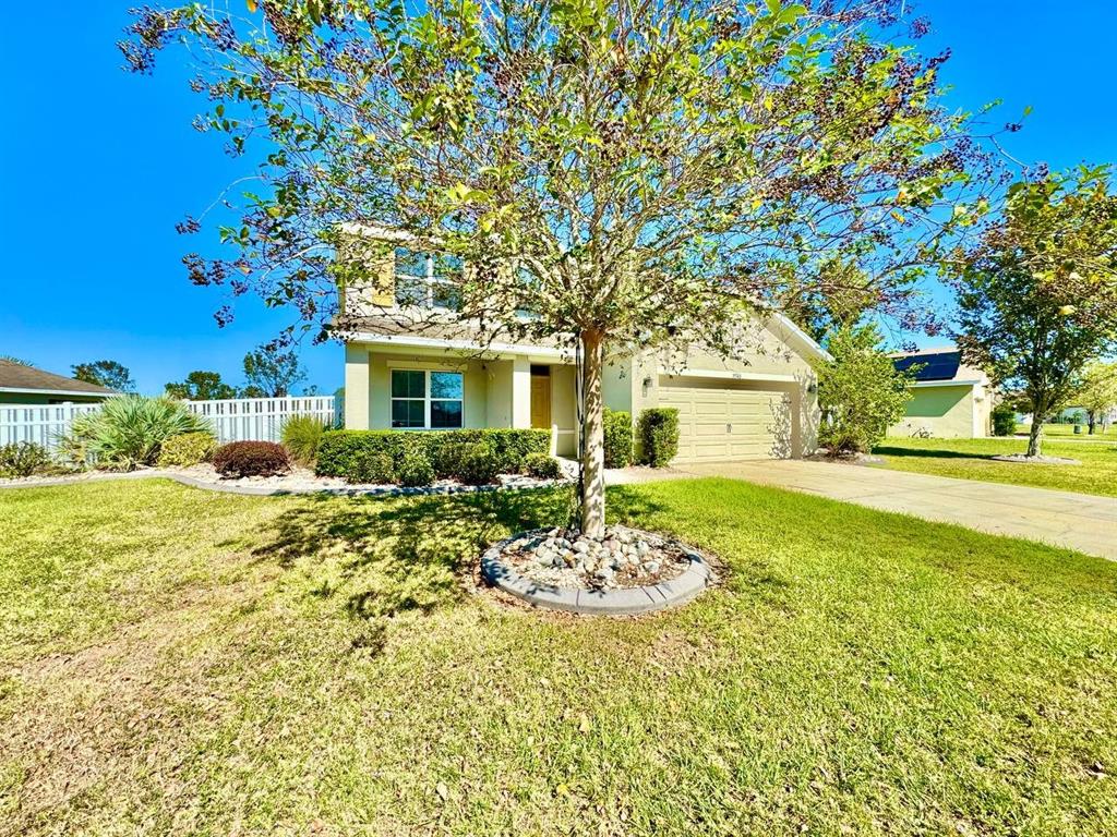 35743 Hillbrook Avenue Zephyrhills, FL 33541 - Photo 4 of 44 a front view of a house with a yard