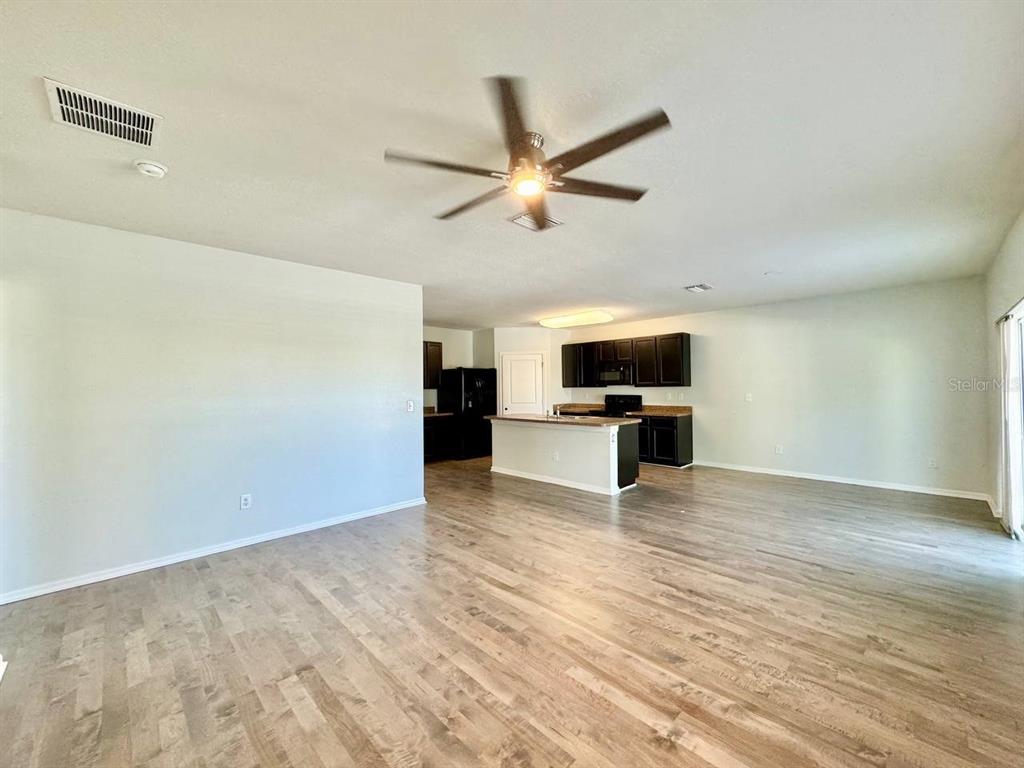 35743 Hillbrook Avenue Zephyrhills, FL 33541 - Photo 9 of 44 a view of kitchen with microwave and floor