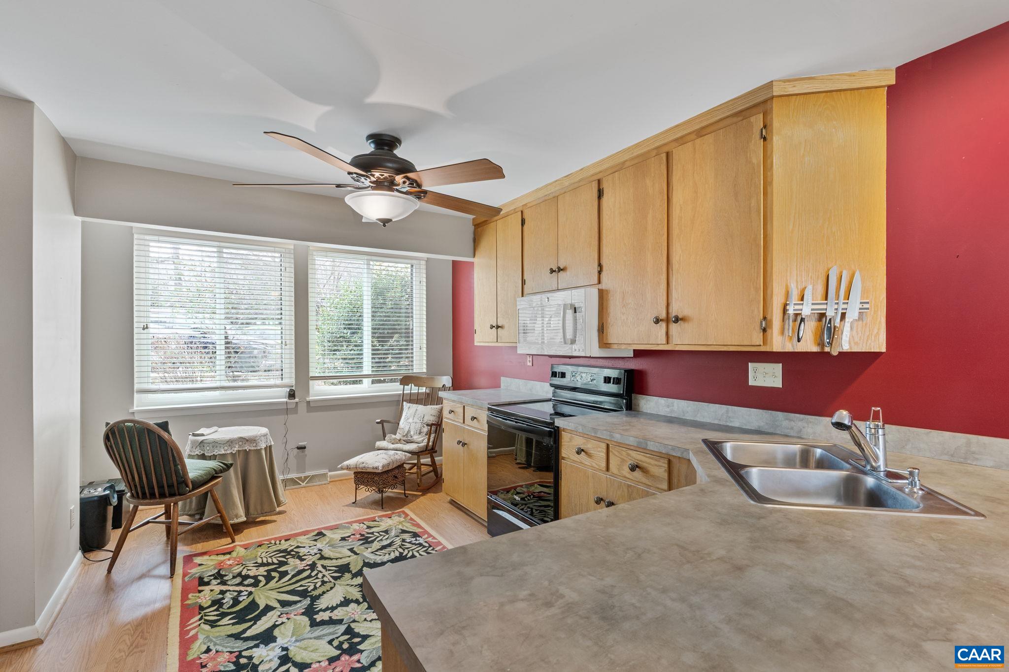 1212 Chatham Ridge Charlottesville, VA 22901 - Photo 7 of 17 a kitchen with a stove a sink and cabinets