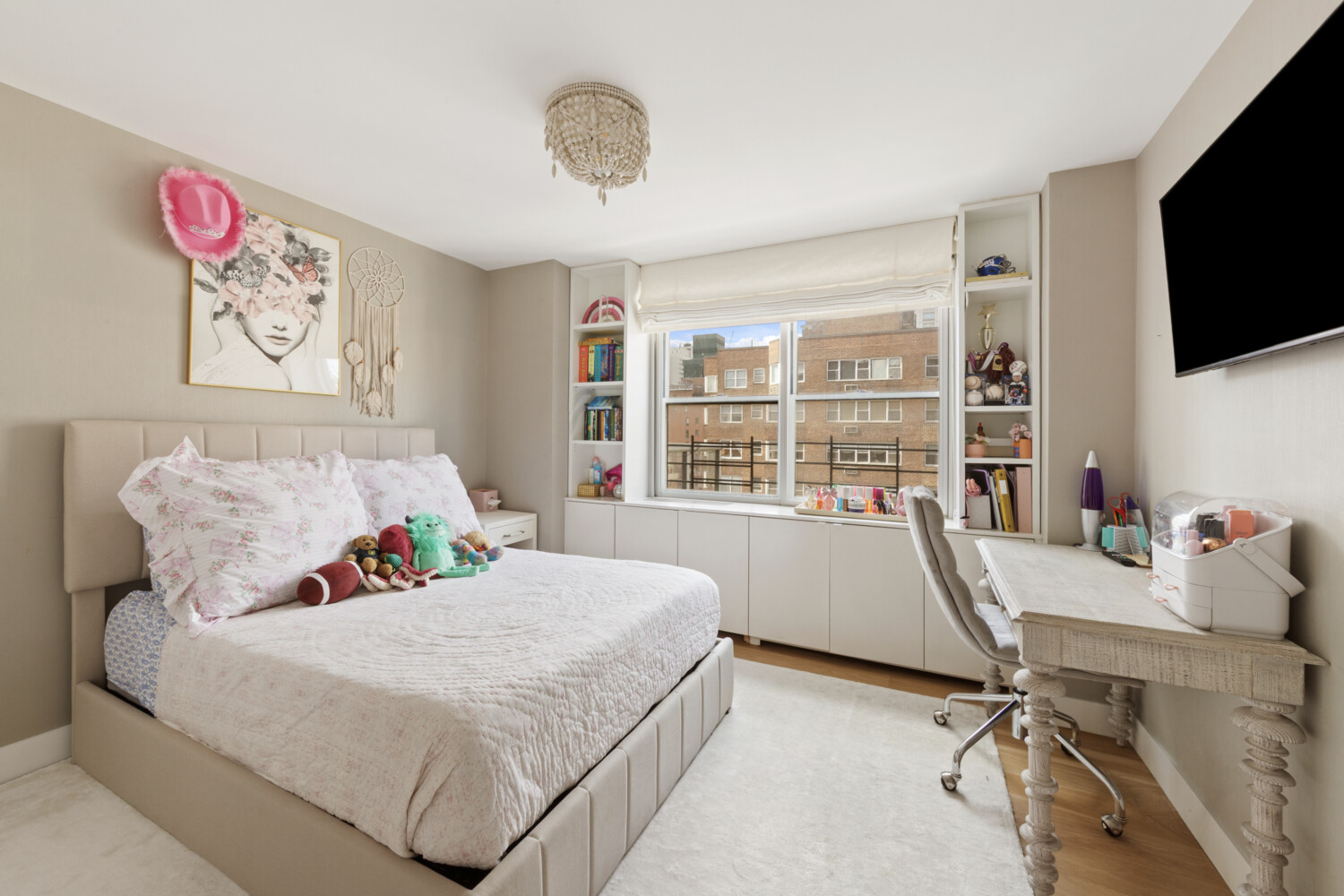 300 East 71st Street, Unit 16HJ Manhattan, NY 10021 - Photo 3 of 8 a bed room with a bed and a television