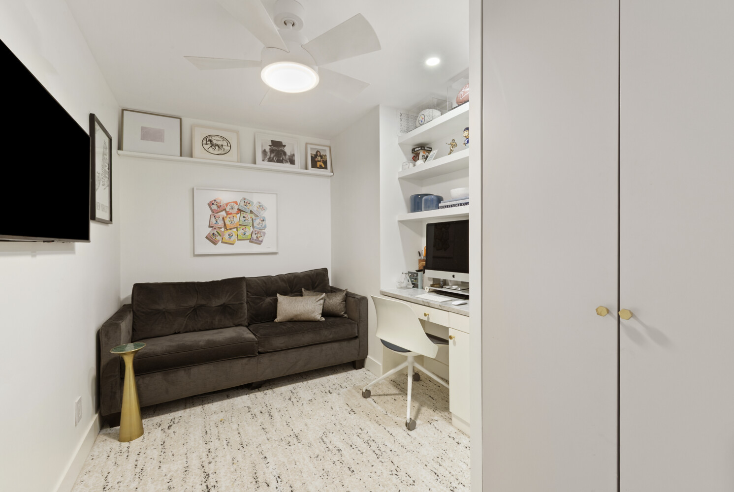300 East 71st Street, Unit 16HJ Manhattan, NY 10021 - Photo 5 of 8 a living room with furniture and a flat screen tv