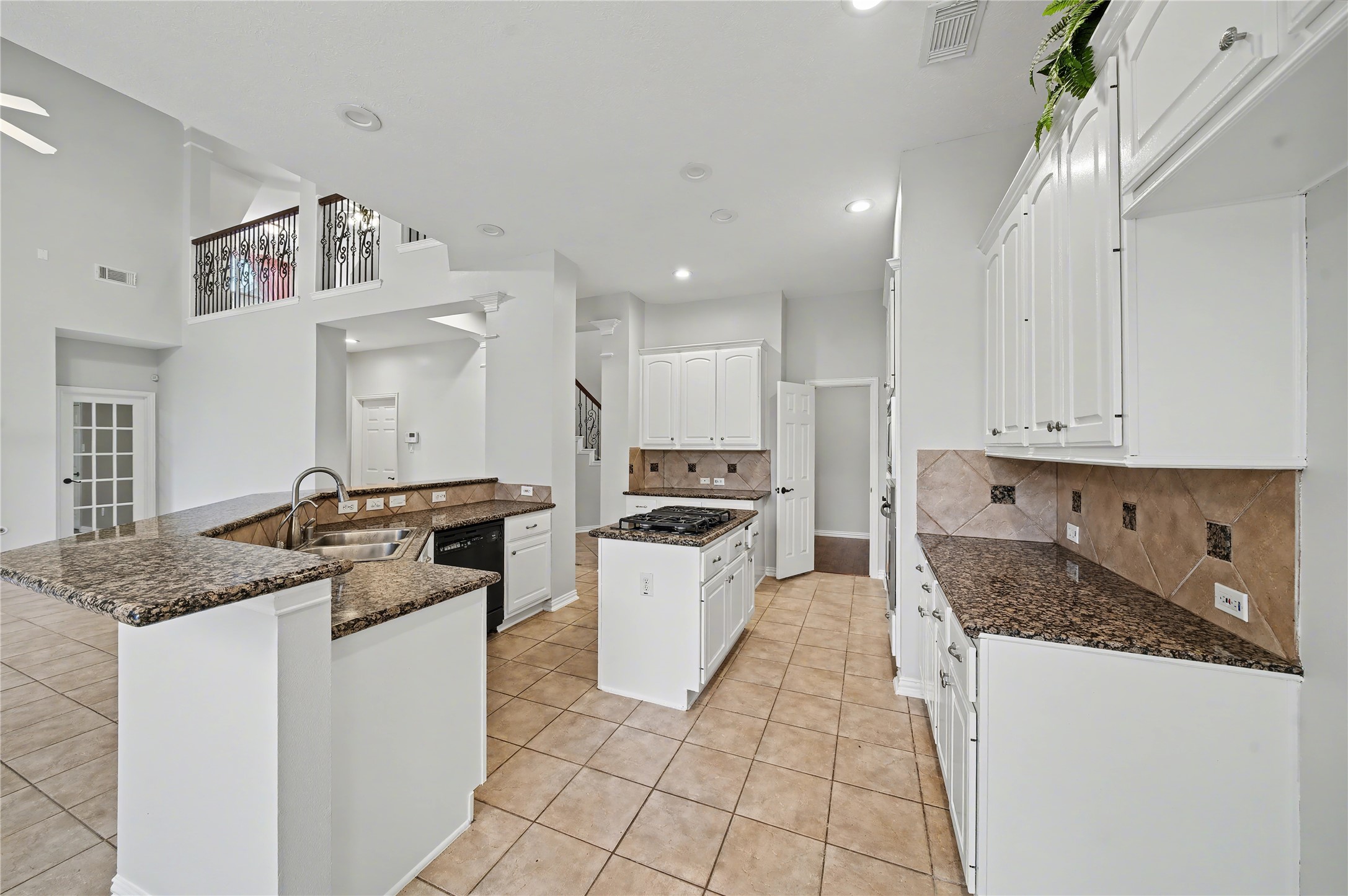 5403 Emerald Pointe Lane Sugar Land, TX 77479 - Photo 32 of 50 a kitchen with a stove sink and cabinets