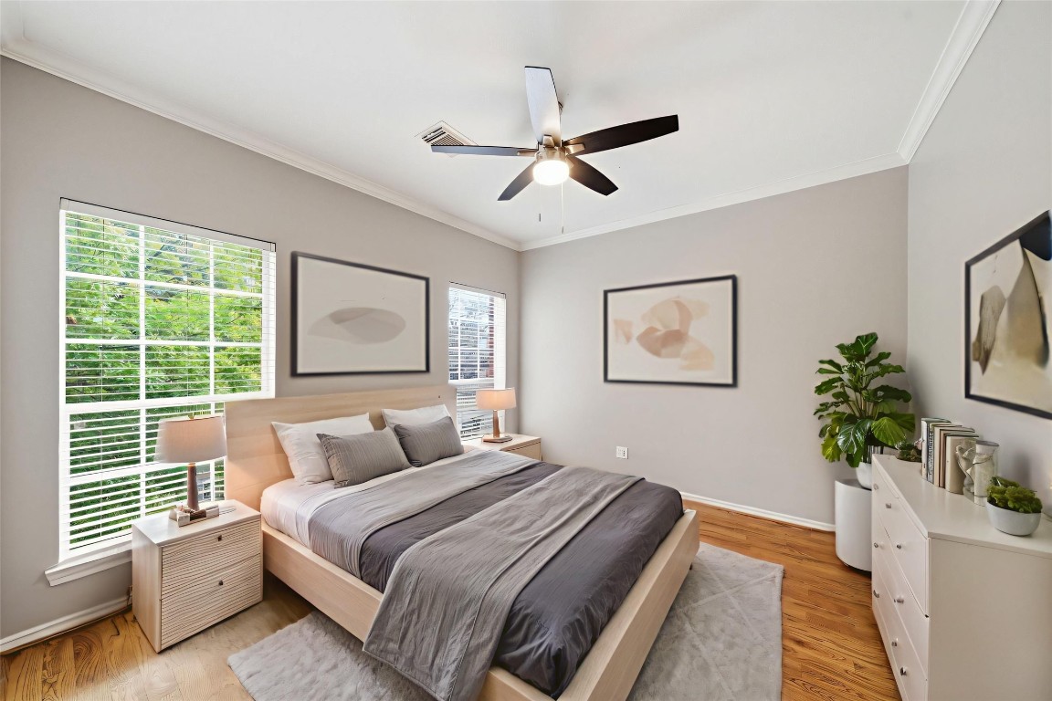 1736 Colquitt Street, Unit A Houston, TX 77098 - Photo 23 of 45 Another secondary bedroom is located at the front of the home and offers large windows and a walk-in closet. - Virtually Staged -