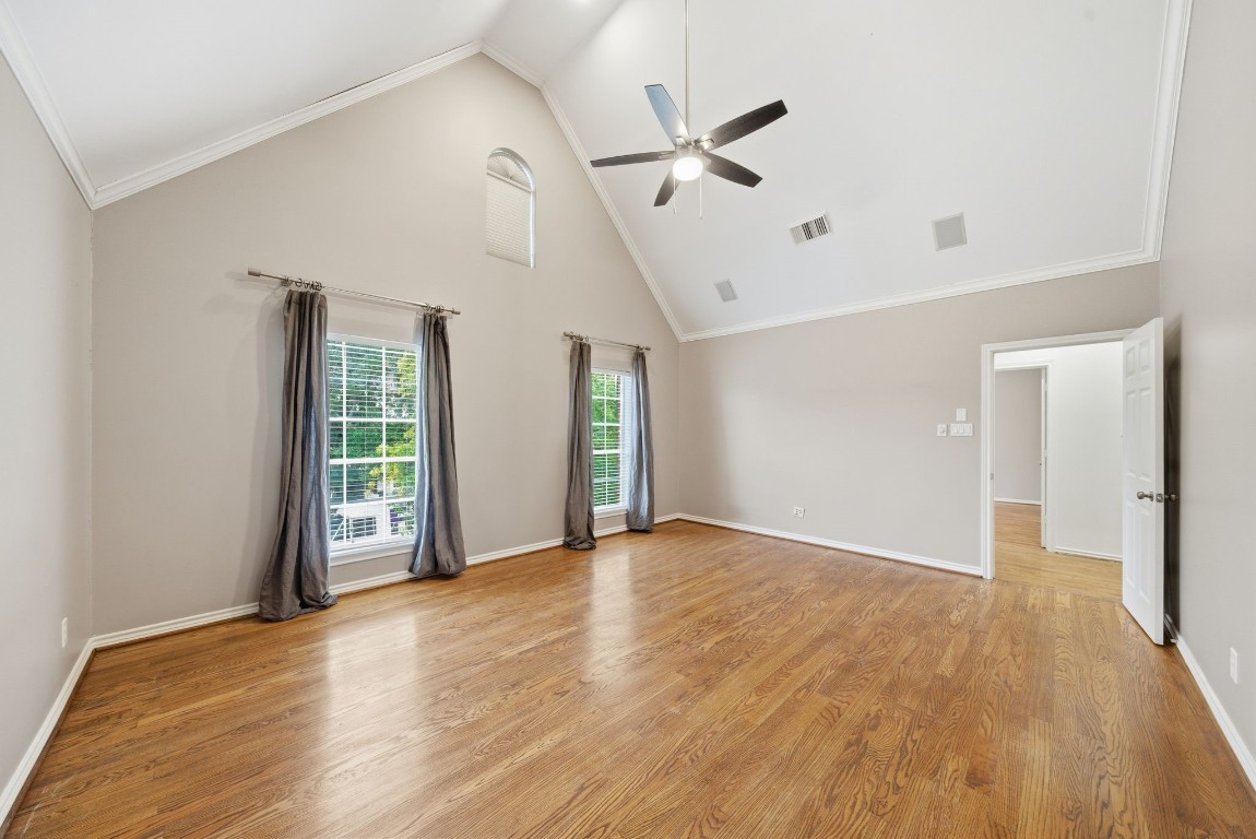 1736 Colquitt Street, Unit A Houston, TX 77098 - Photo 28 of 45 a view of an empty room with a window and wooden floor