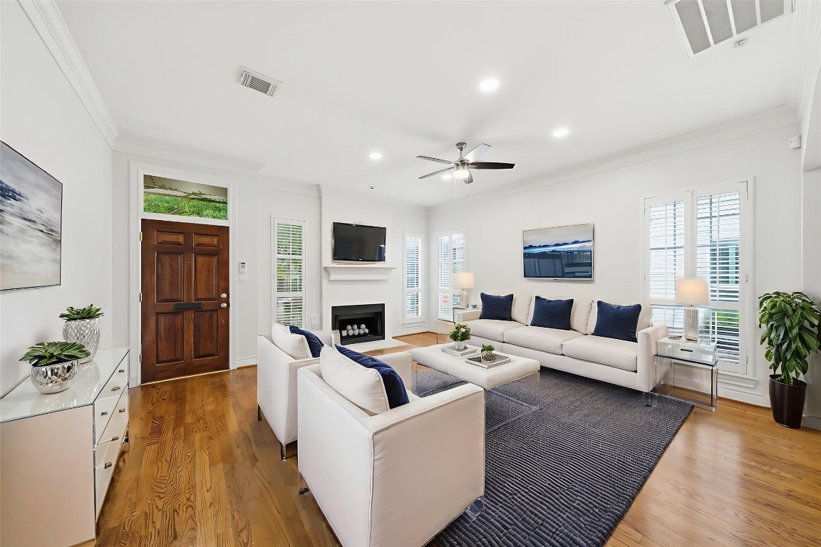 1736 Colquitt Street, Unit A Houston, TX 77098 - Photo 3 of 45 The sun-filled living room features high ceilings and crisp, clean lines, elevated by classic millwork. - Virtually Staged -