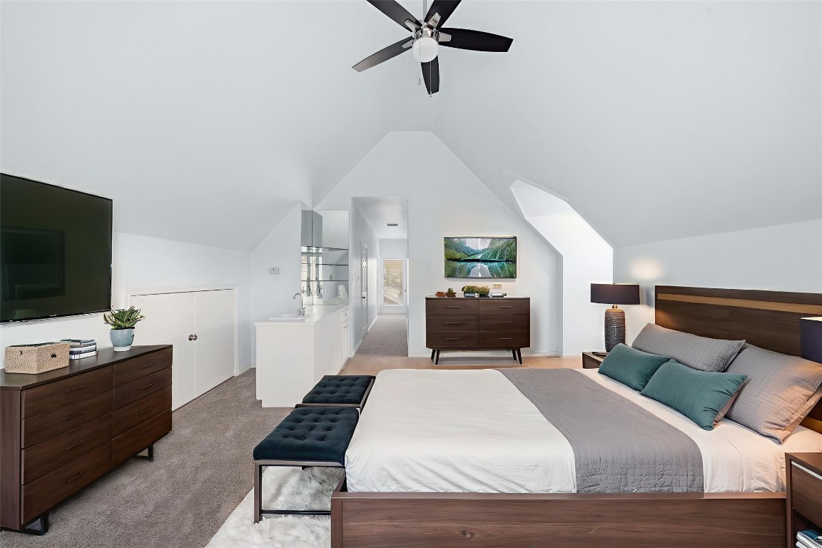 1736 Colquitt Street, Unit A Houston, TX 77098 - Photo 40 of 45 The same third-floor flex space is reimagined here as a spacious guest suite, enhanced by multiple windows, a walk-in closet, and convenient access to the wet bar. - Virtually Staged -