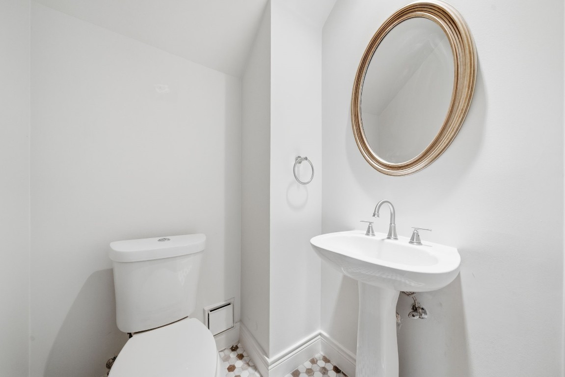 1736 Colquitt Street, Unit A Houston, TX 77098 - Photo 9 of 45 a bathroom with a sink and a mirror
