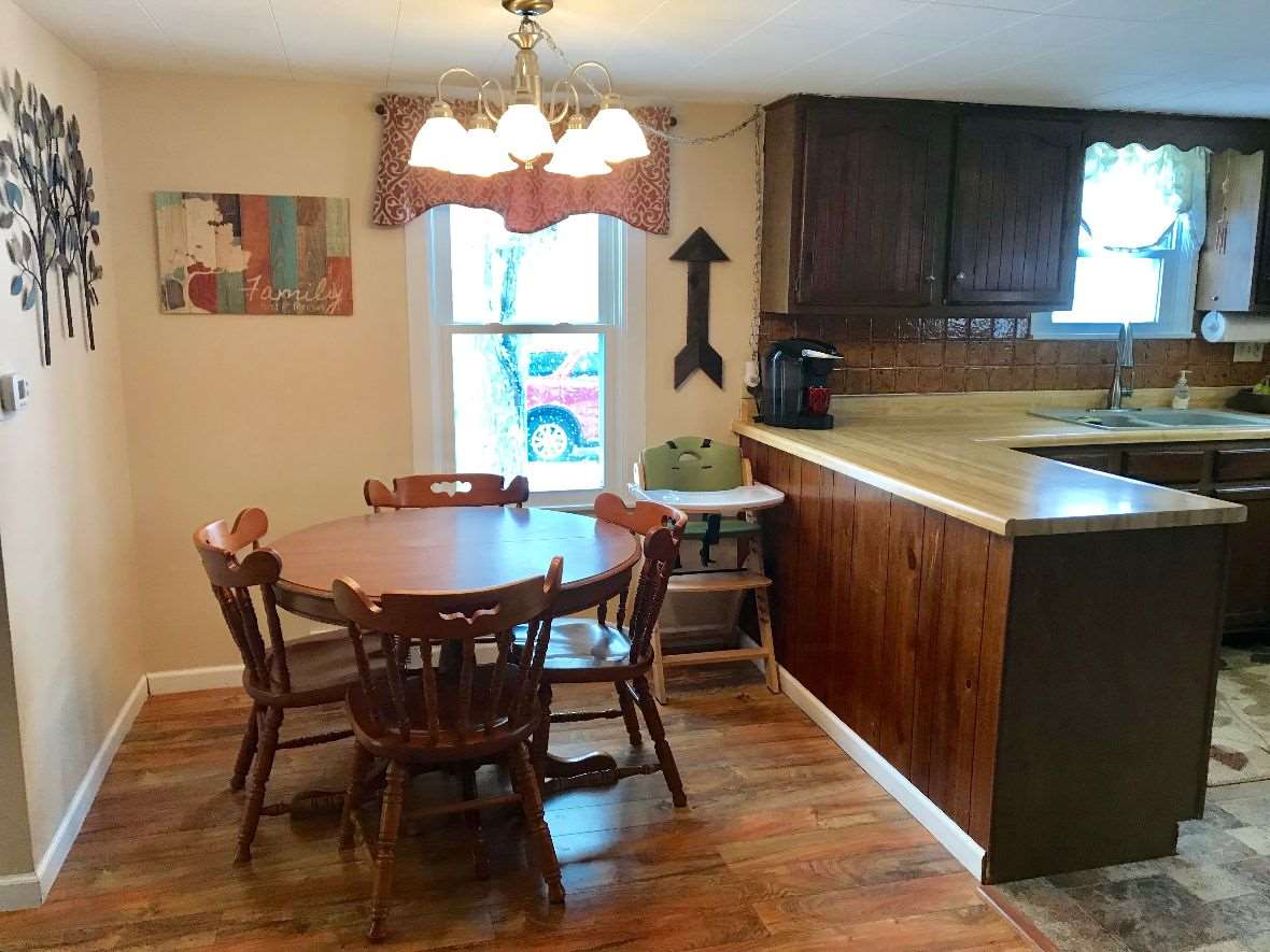 216 South Washington Street Byron, IL 61010 - Photo 11 of 25 a view of a dining room with furniture and window