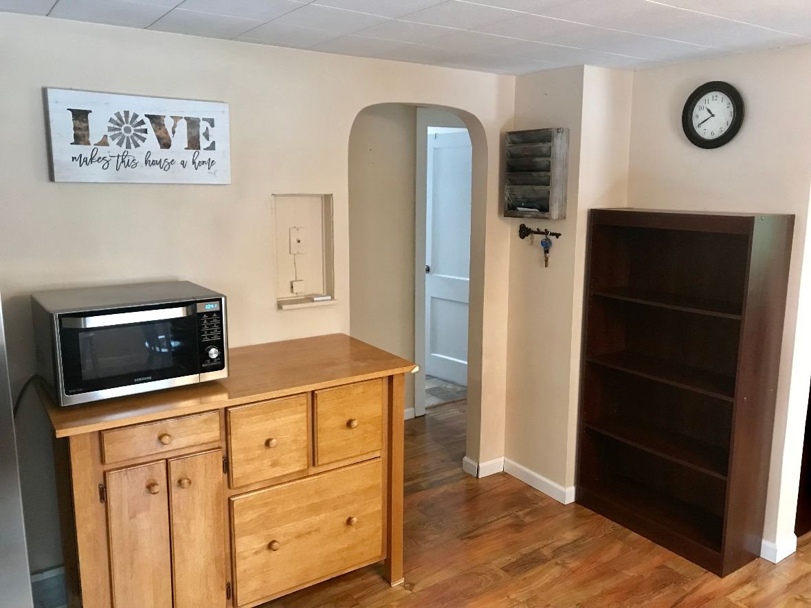 216 South Washington Street Byron, IL 61010 - Photo 15 of 25 a kitchen with a refrigerator and a stove