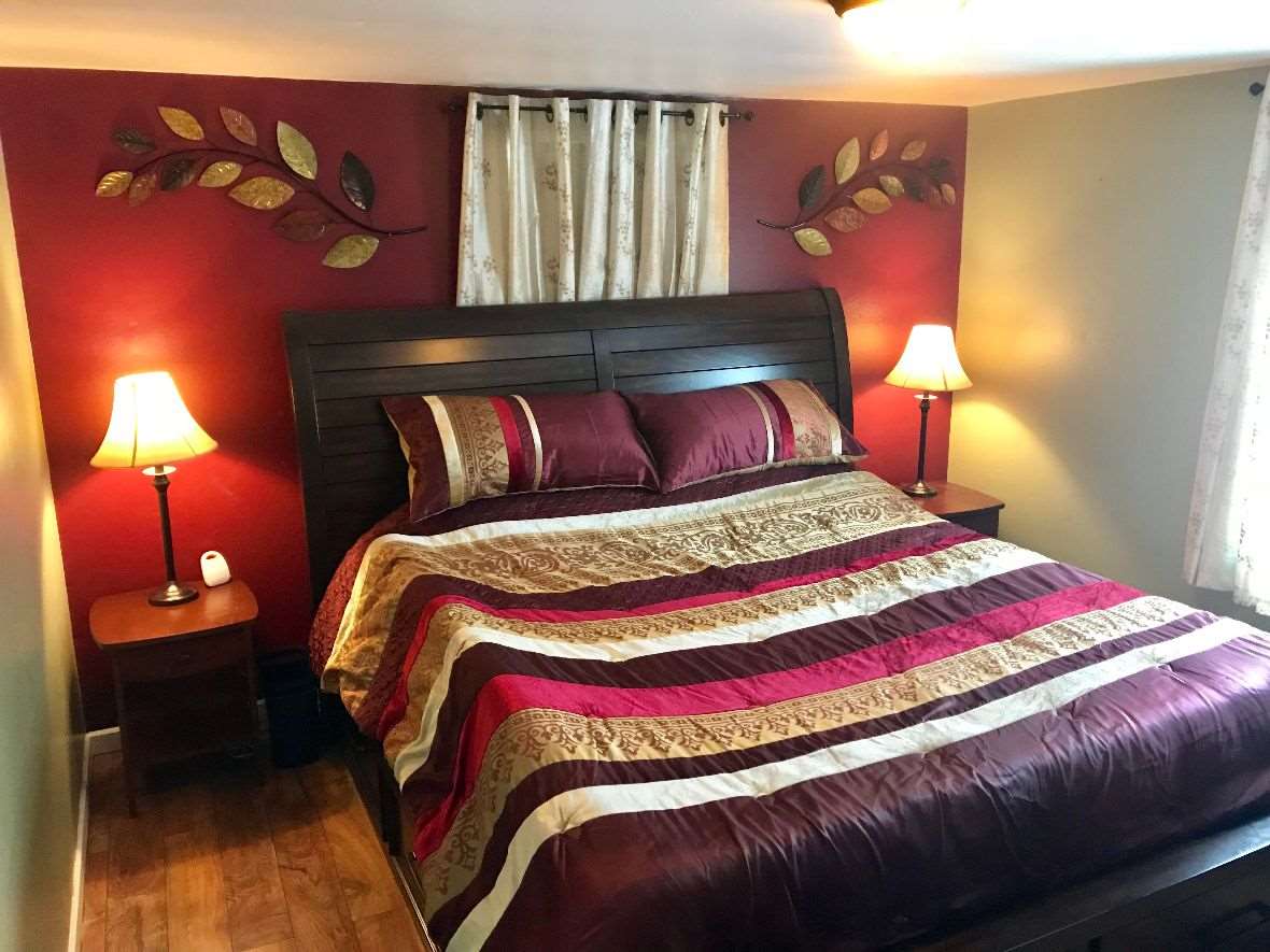 216 South Washington Street Byron, IL 61010 - Photo 16 of 25 a bedroom with a bed and a lamp