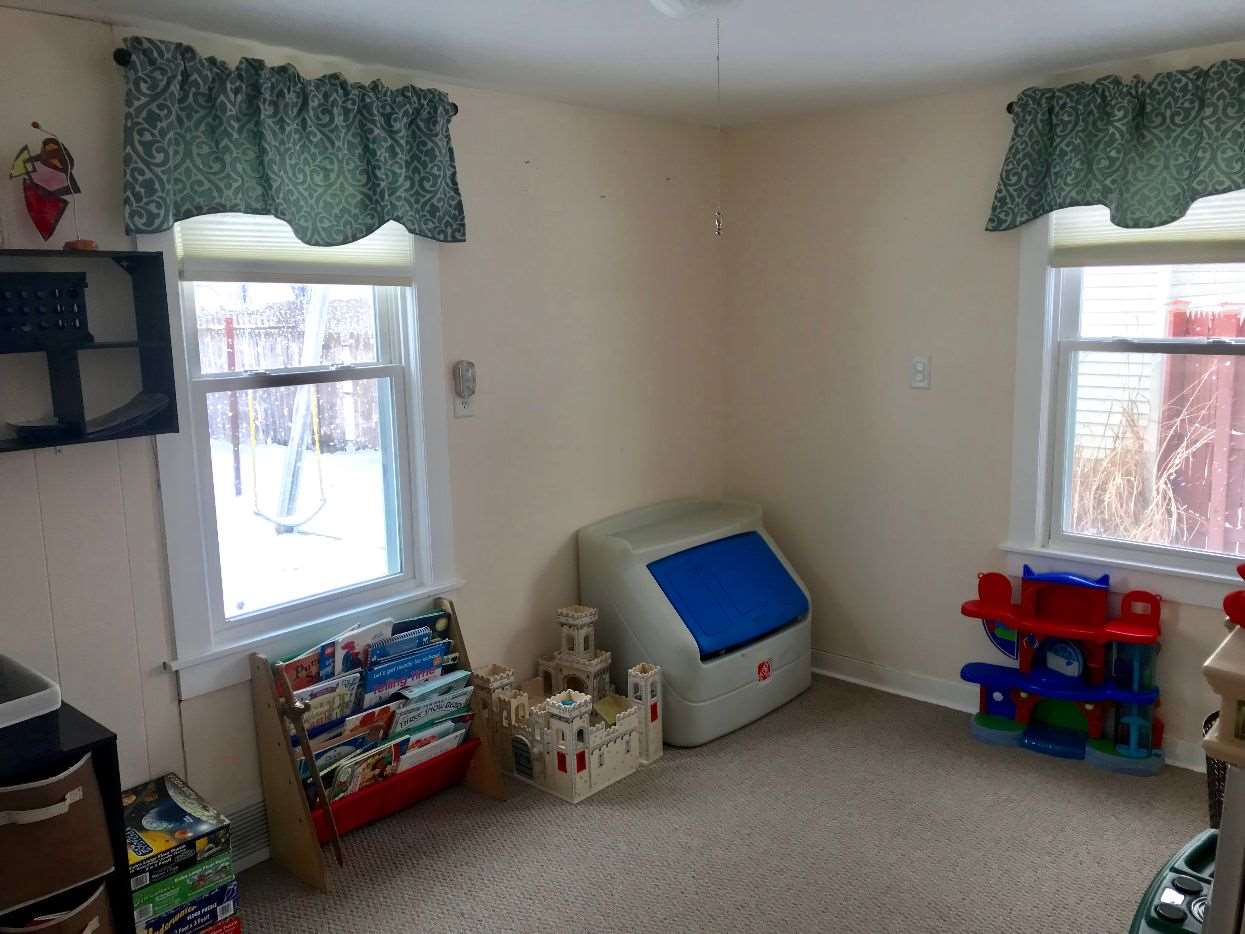 216 South Washington Street Byron, IL 61010 - Photo 18 of 25 a room with toys and a window