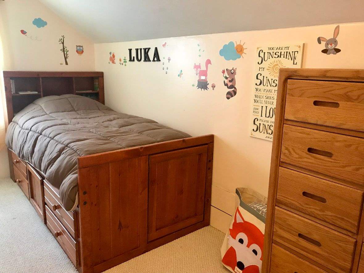 216 South Washington Street Byron, IL 61010 - Photo 23 of 25 a bedroom with a bed and a dresser