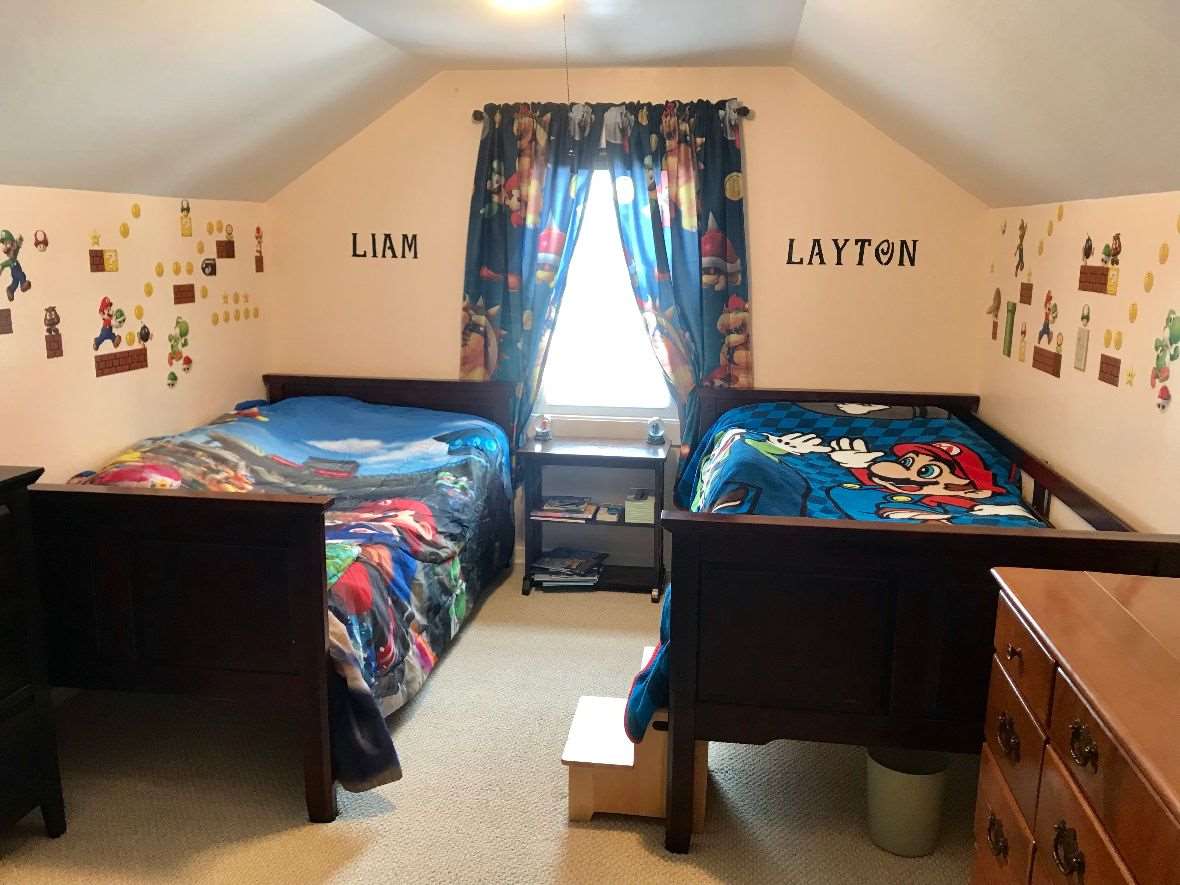 216 South Washington Street Byron, IL 61010 - Photo 24 of 25 a bedroom with a bed and a window