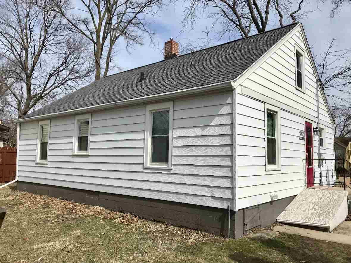 216 South Washington Street Byron, IL 61010 - Photo 3 of 25 a view of a house with a yard and a large window