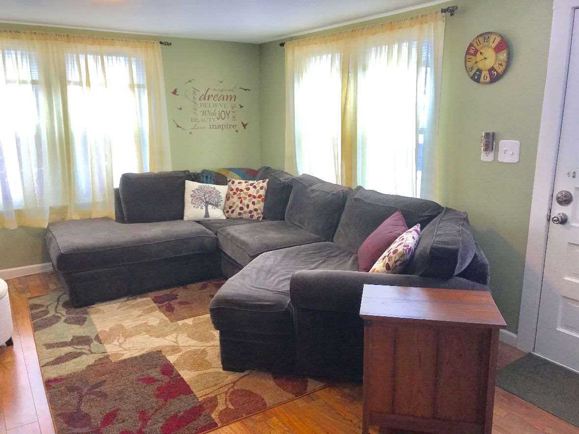 216 South Washington Street Byron, IL 61010 - Photo 5 of 25 a living room with furniture and a window