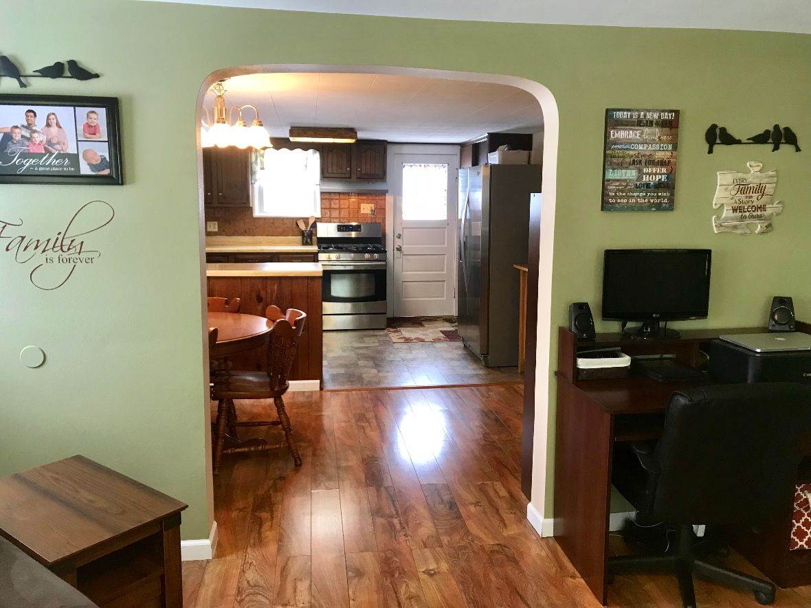 216 South Washington Street Byron, IL 61010 - Photo 9 of 25 a view of a living room and dining room