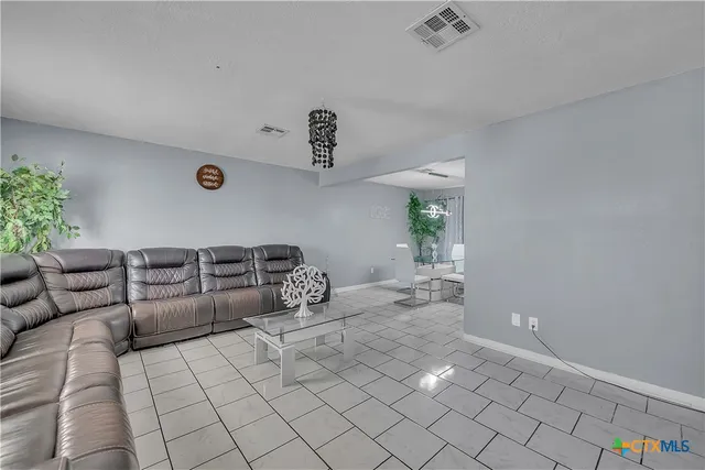 a living room with furniture and a table
