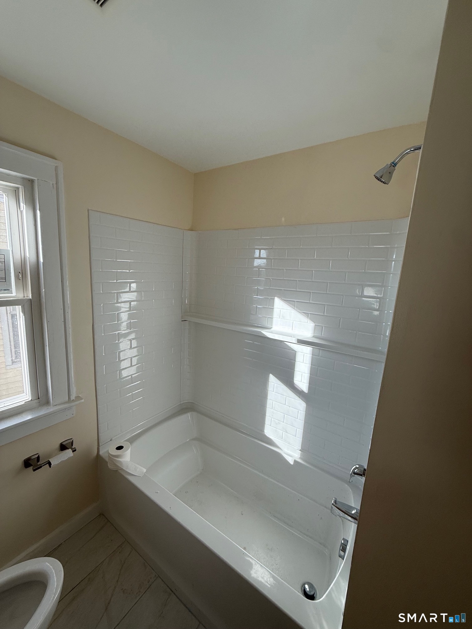 484 West Street Bristol, CT 06010 - Photo 11 of 15 a bathroom with a tub and shower