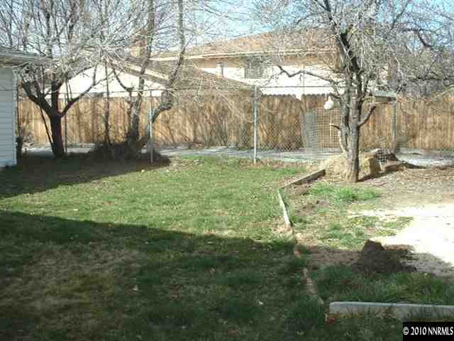 225 Hillcrest Drive Reno, NV 89509 - Photo 5 of 7 a backyard of a house with lots of green space