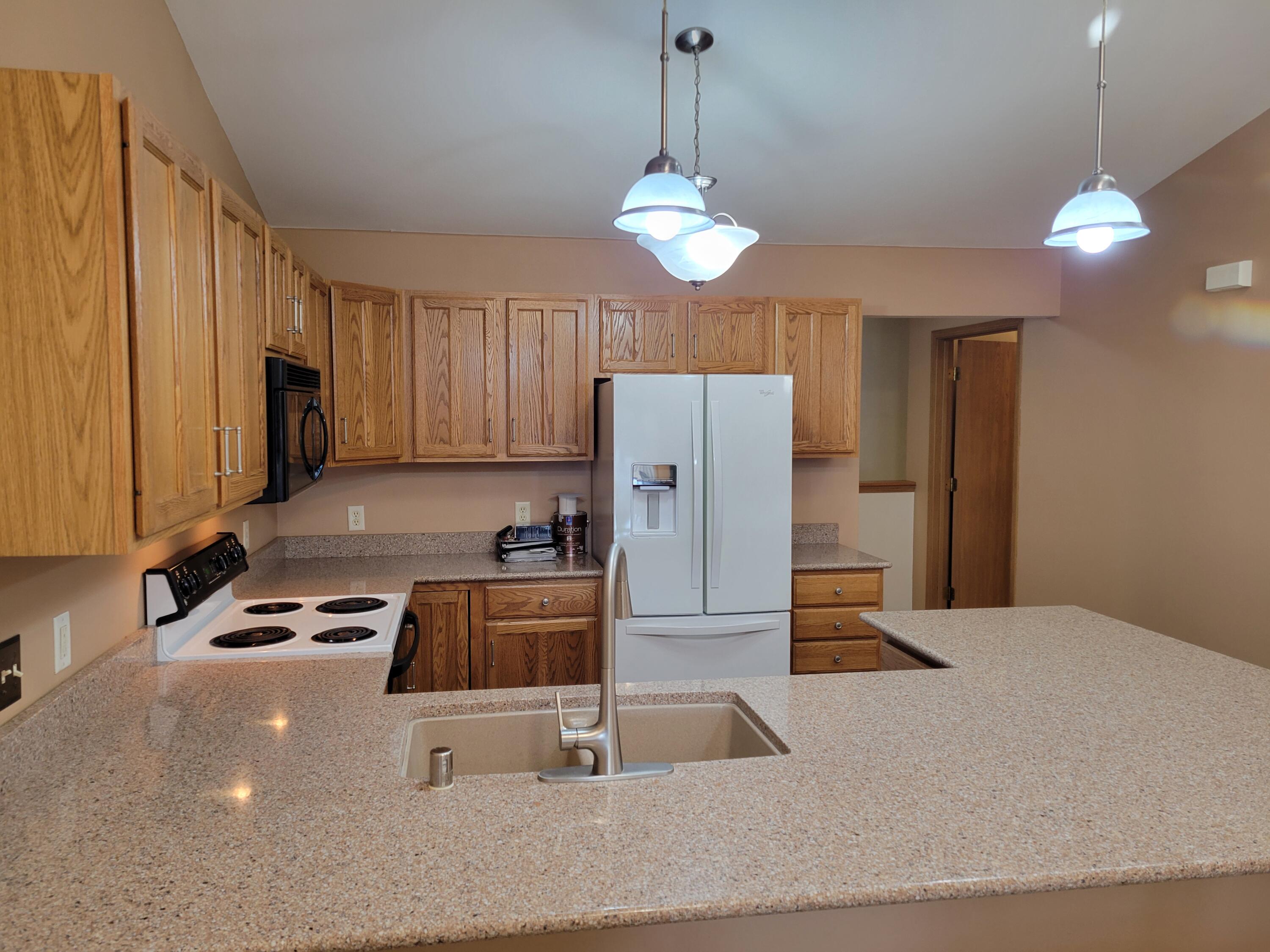 2111 Pine Ridge Court, Unit E Grafton, WI 53024 - Photo 11 of 35 Chef's prep area