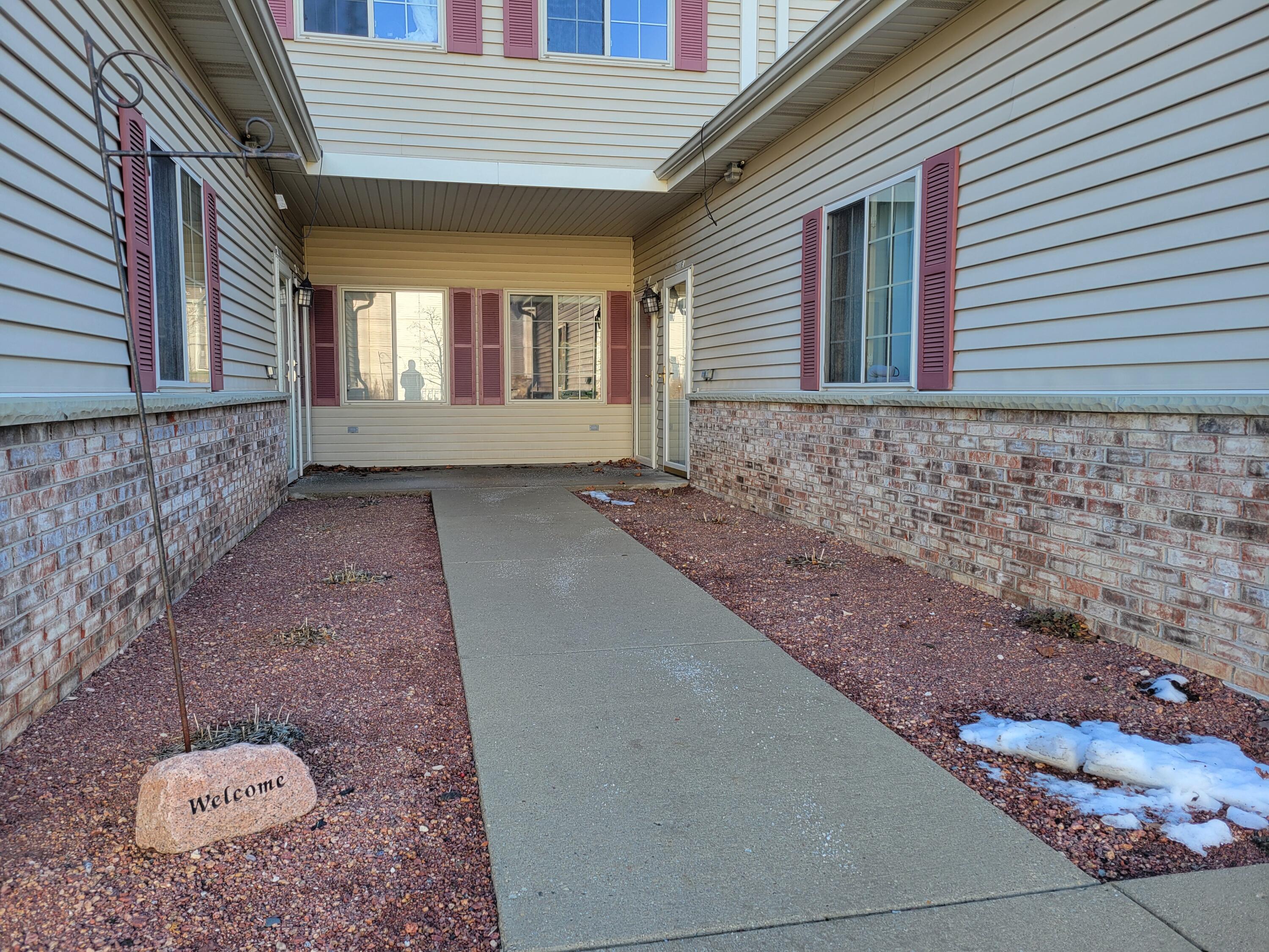 2111 Pine Ridge Court, Unit E Grafton, WI 53024 - Photo 2 of 35 Walkway to front door